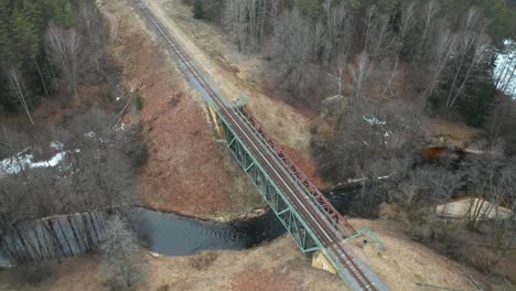 AERIAL:-Bridge-with-Train-Rail-Road-Constructed-Over-Remote-Shallow-River