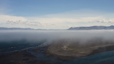 AERIAL---Blue-horizon-above-coastline,-Hvitserkur,Vatnsnes,-Iceland,-circle-pan