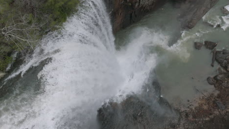 Slow-motion-aerial-shot-of-waterfall-top-down