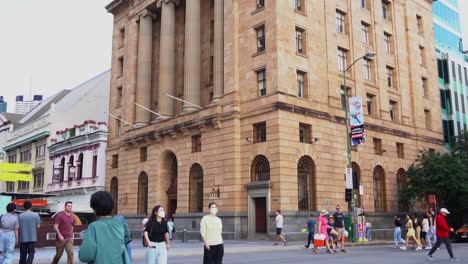 The-exterior-of-Westpac-building-at-Queen-street,-Brisbane-city,-heritage-listed-former-bank-of-new-south-wales,-handheld-motion-tilt-up-shot