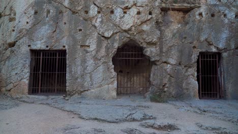 Rock-Carved-Prison-of-Socrates-with-Metal-Bars