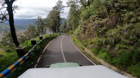 One's-point-of-view-is-to-see-the-beautiful-winding-road-in-the-Bromo-area-from-the-top-of-a-moving-car