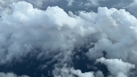 Aerial-cockpit-lateral-view-of-some-sumulus-clouds-over-Mediterranean-Sea