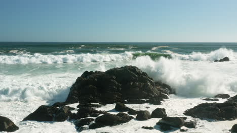 Powerful-Foamy-Waves-Splashing-On-Coastal-Rocks-At-West-Coast-National-Park,-South-Africa---drone-shot