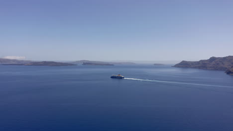Aerial:-Ferry-boat-traveling-in-the-open-blue-sea-between-small-islands