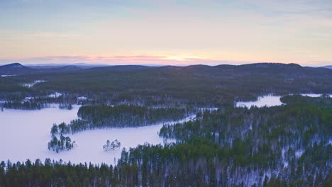 Drone-Footage-Of-Winter-Landscape-In-Scandinavia-After-Sunset