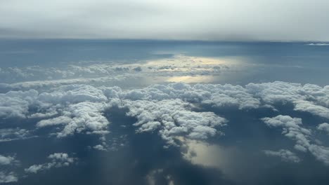Aerial-view-from-a-cockpit-of-some-low-clouds-in-the-sunset
