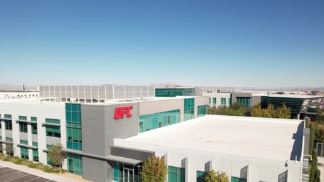 Ascending-aerial-view-of-the-Ultimate-Fighting-Champion-UFC-APEX-industrial-park-building-in-Las-Vegas,-California-at-daytime