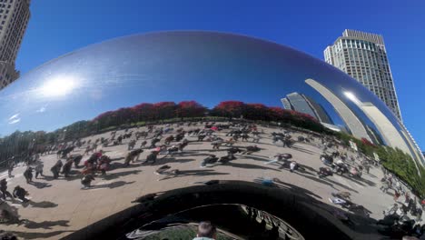 Bean-statue-in-Chicago,-Illinois-with-gimbal-video-walking-forward-close-up