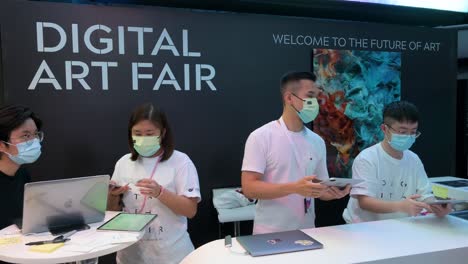 Chinese-visitors-and-art-enthusiasts-arrive-at-the-Digital-Art-Fair-Asia-showcasing-upcoming-trends-such-as-Web-3