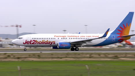 close-up-shot-of-a-boeing-737-of-airline-jet2holidays-landing-at-Faro-airport-in-Portugal