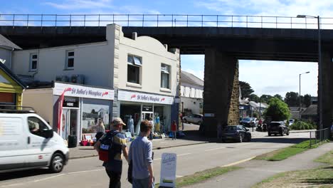 Shopping-Town-with-Passing-Motorists-and-People-Walking-Along-the-Road-in-Hayle-near-the-Railway-Viaduct