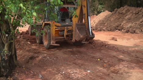 JCB-Bulldozer-engaged-in-collecting-clay-after-digging-and-dumping-it-on-the-other-side