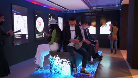 Chinese-visitors-interact-with-a-digital-art-installation-at-the-Digital-Art-Fair-showcasing-upcoming-trends-such-as-Web-3