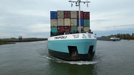 Aerial-Flying-Across-Forward-Bow-Of-Tripoli-Cargo-Ship-Navigating-Oude-Maas-On-23-October-2022