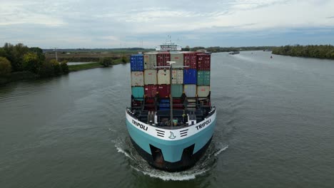 Zwijndrecht,-Belgium---23-September-2022:-Cargo-ship-sailing-on-Schelda-river-in-Zwijndrecht,-Netherlands,-carrying-containers