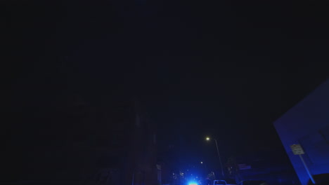 Police-cars-patrol-at-night-in-Los-Angeles,-Georgia,-USA