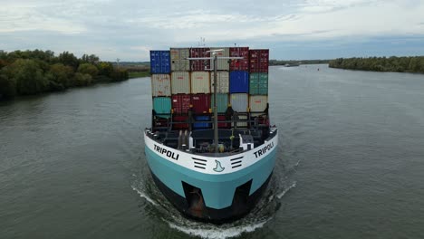 Zwijndrecht,-Belgium---23-September-2022-Tripoli-cargo-ship-sailing-on-Schelda-river-trading-containers-import-export-business