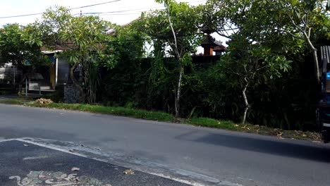 Time-Lapse-Road-in-Bali-Indonesia-Local-Village-Motorbikes-Scooter,-Cars,-People-Gianyar-Regency,-Daytime-Light,-Street