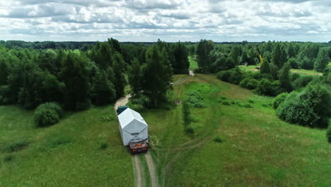Pre-fabricated-modular-house-trasported-by-truck-on-country-road-in-Latvia