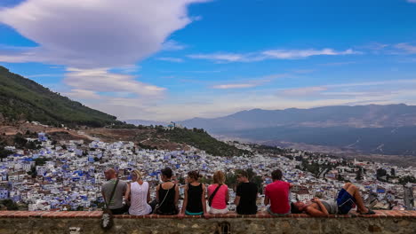 Backpacker-travelers-admiring-the-beauty-of-blue-washed-Chefchaouen-city