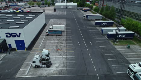 aerial-footage-of-a-building-and-parking-of-the-dsv-transport-company-in-Riga-latvia