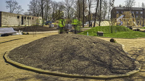 Laying-grass-sod-turf-at-a-new-public-park-an-playground---time-lapse