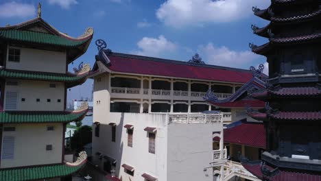 Aerial-panorama-of-colorful-Buddhist-temple-on-sunny-day-with-blue-sky