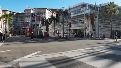 Beverly-Hills-CA-USA,-People-on-Rodeo-Drive-Walking-in-Front-of-Louis-Vuitton-High-End-Store