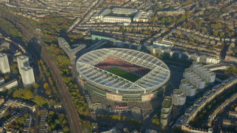 High-circling-aerial-shot-of-Arsenal-football-stadium-during-a-game