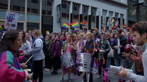 Drummers-heating-the-crowd-in-Oslo-Pride-2022-movement,-side-view