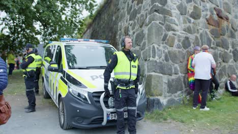 Confident-officer-looking-at-Oslo-Pride-2022-to-avoid-criminal-actions