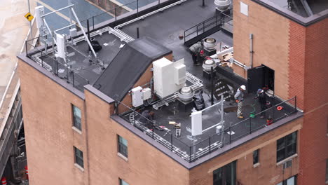 Overlooking-Workers-On-Building-Rooftop-In-New-York