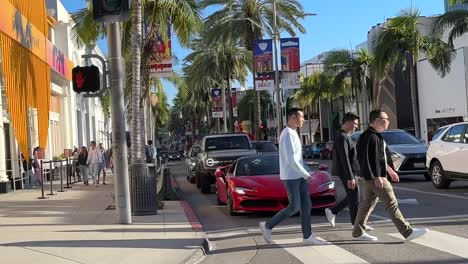 Driving-Past-Red-Ferrari-488-GTB-At-Traffic-Lights-On-Rodeo-Drive,-Beverly-Hills