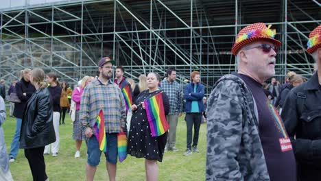Elder-people-enjoying-Oslo-Pride-2022-and-talking,-camera-passing-by