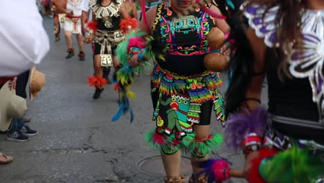 Indigenous-People-Wearing-Colorful-Costumes-And-Feathered-Hairdresses-During-The-XXIV-Meeting-of-Ancestral-Dances-In-Tuxpan,-Jalisco,-Mexico