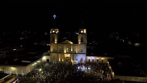 Aerial-View-Of-XXIV-Meeting-Of-Ancestral-Dances-At-Night-In-Front-Of-Tuxpan-Cathedral-In-Jalisco-State,-Mexico
