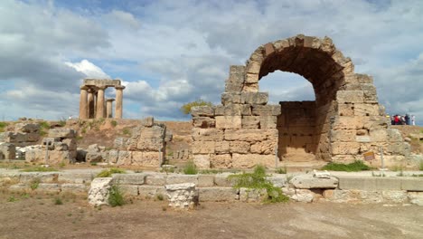 Panoramic-View-of-Ruined-Shop-of-Agora-in-City-of-Ancient-Corinth-and-Temple-of-Apollo-in-Background