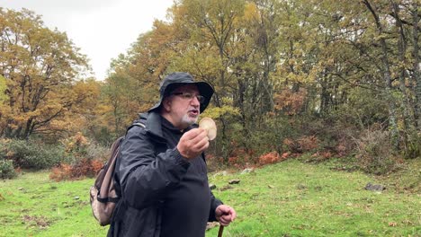 Old-Expert-Explaining-Mushroom-On-Guided-Tour-In-Spanish-countryside