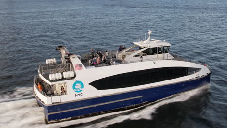Aerial-Close-Up-View-Of-NYC-Ferry-Travelling-Across-Water
