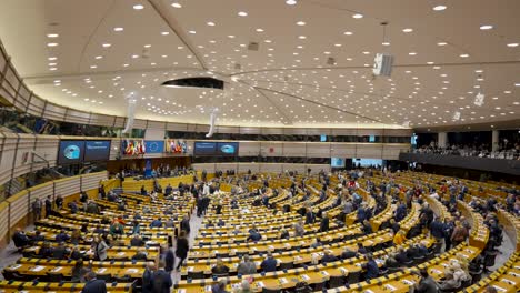 Politicians-arriving-in-the-European-Parliament-Room,-debating-chamber-in-Brussels,-Belgium---Time-Lapse