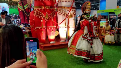 indian-dancer-wearing-traditional-clothes-and-mask-from-Kerala-India-performing-during-World-Travel-Market-expo