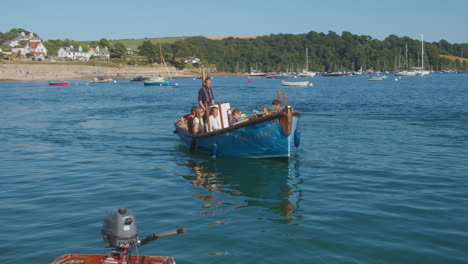Wooden-Boat-With-Tourists-Sailing-Near-Falmouth-Harbour-In-St-Mawes,-Handheld-Shot