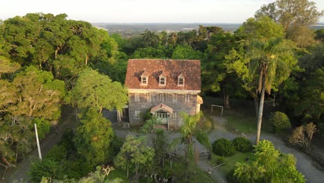 Palácio-do-Pinho,-is-a-historical-mansion-from-the-beginning-of-the-20th-century,-located-in-the-Irati-National-Forest,-in-the-state-of-Paraná,-Brazil,-drone-view