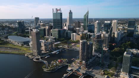 Perth-city,-on-a-partly,-sunny-day,-in-Australia---Aerial,-pull-back,-drone-shot