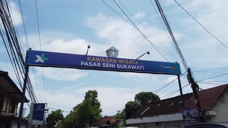 Entrance-Banner-of-Sukawati-Art-Market-in-Bali-Indonesia,-Asian-Artistic-Famous-Retail-Merchandise-Village,-Gianyar-Tourism-and-Travel