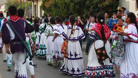 Dancing-Men-And-Women-In-The-Street-Wearing-Traditional-Mexican-Dresses-At-The-Ancestral-Dances-Festival-In-Tuxpan,-Jalisco,-Mexico