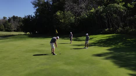 high-sweeping-shot-over-a-golfer-taking-a-shot