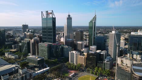 Perth-city,-on-a-partly,-sunny-day,-in-Australia---Aerial,-pull-back,-drone-shot