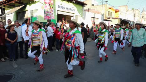 Los-Sonajeros-Dancing-On-The-Street-During-XXIV-Meeting-of-Ancestral-Dances-In-Tuxpan,-Jalisco,-Mexico